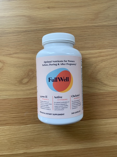 A bottle of FullWell prenatal vitamins.