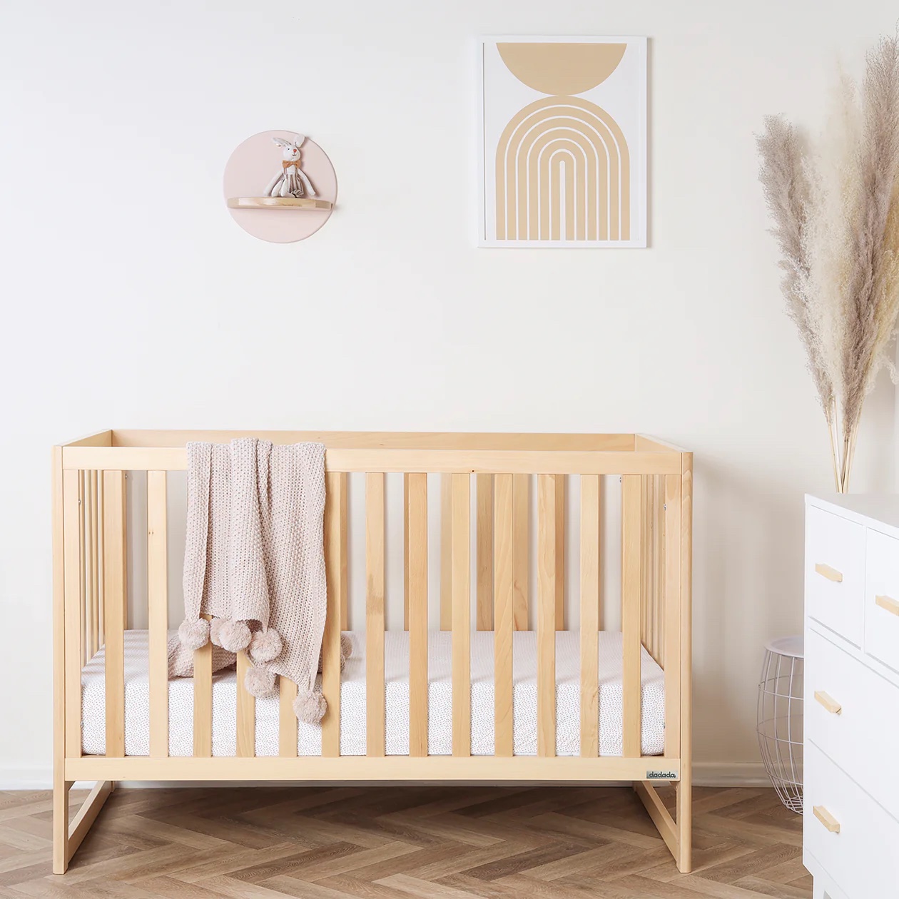 A natural wooden crib.