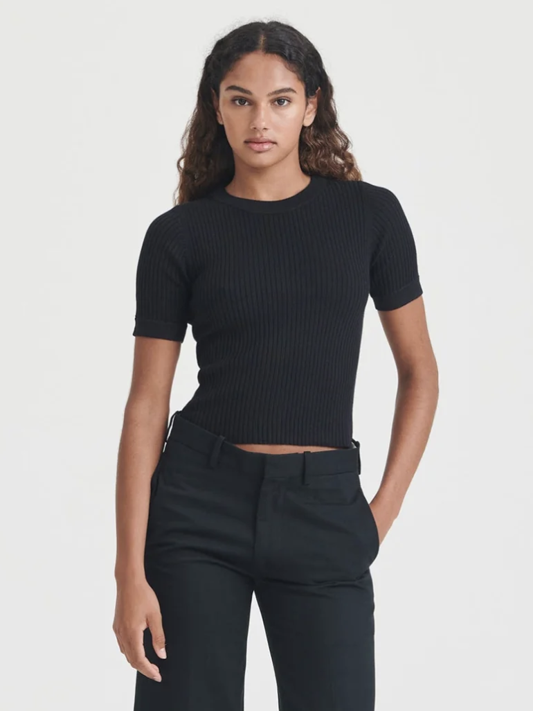 A model in a short sleeve sweater from Naadam