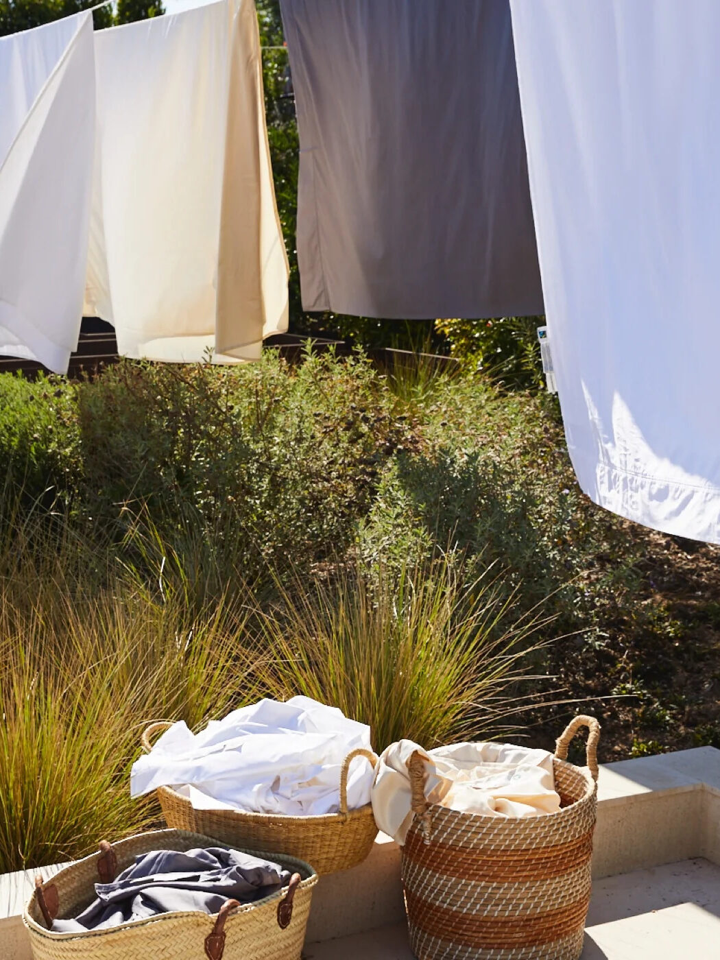 Avocado bed sheets hanging to dry on a clothesline.