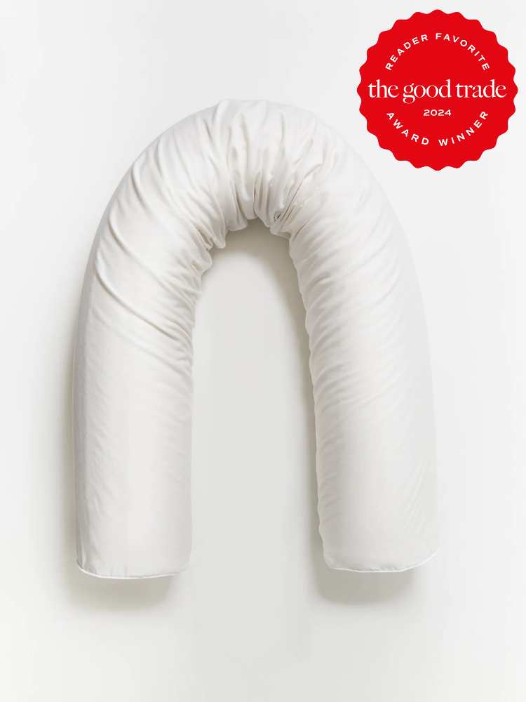 A Coyuchi body pillow. The TGT 2024 Award Winner Badge is on the right corner of the image.