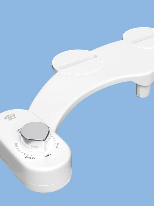 A close up of the Squatty Potty bidet.