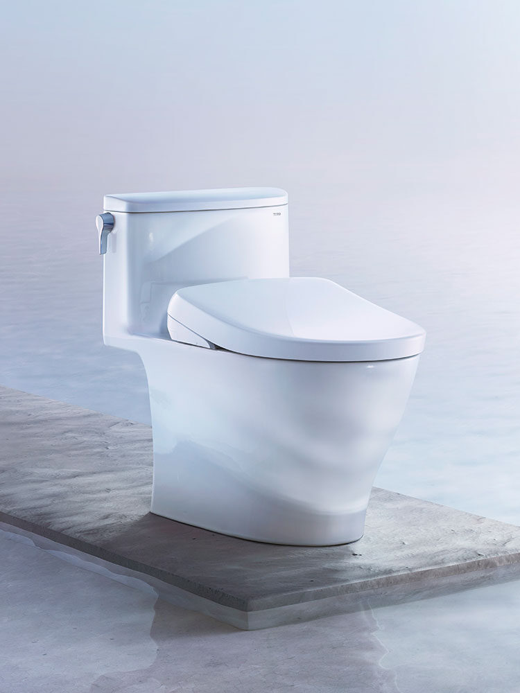 A toilet with a TOTO bidet.