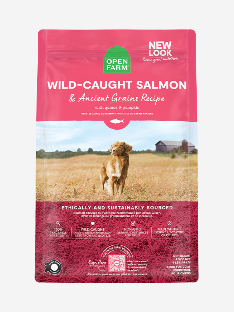 A bag of Open Farm Wild-Caught Salmon & Ancient Grains Recipe dog food, featuring a golden dog in a field, with details about being ethically and sustainably sourced.