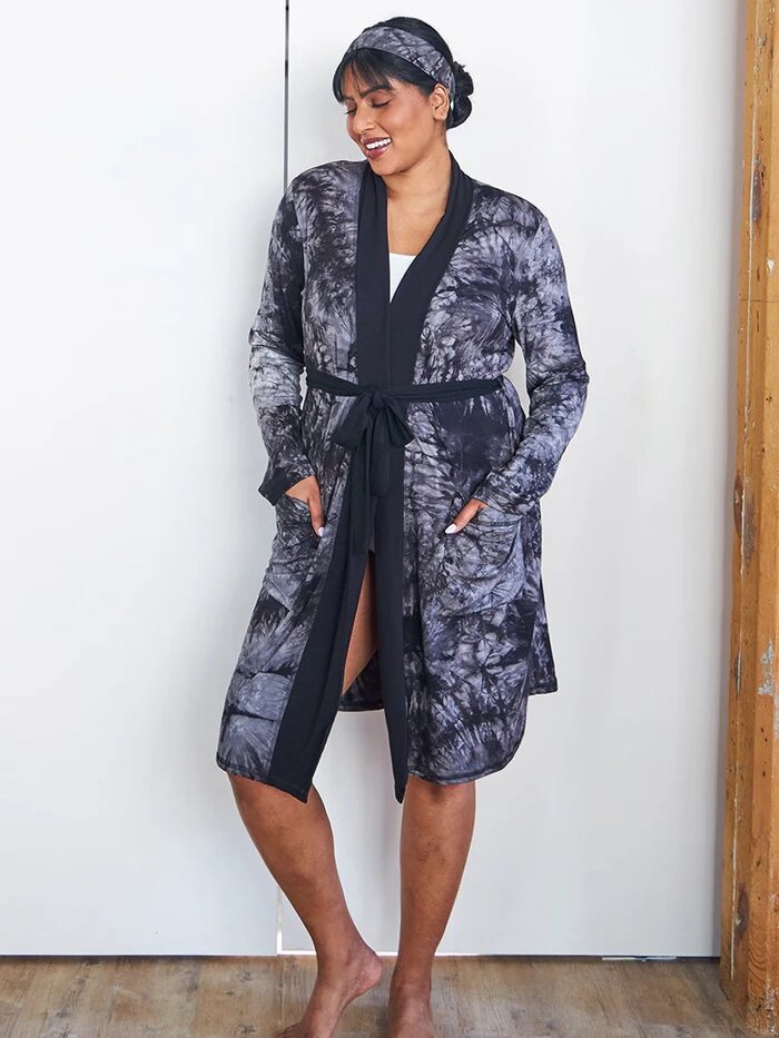 A model wearing a This is J robe.