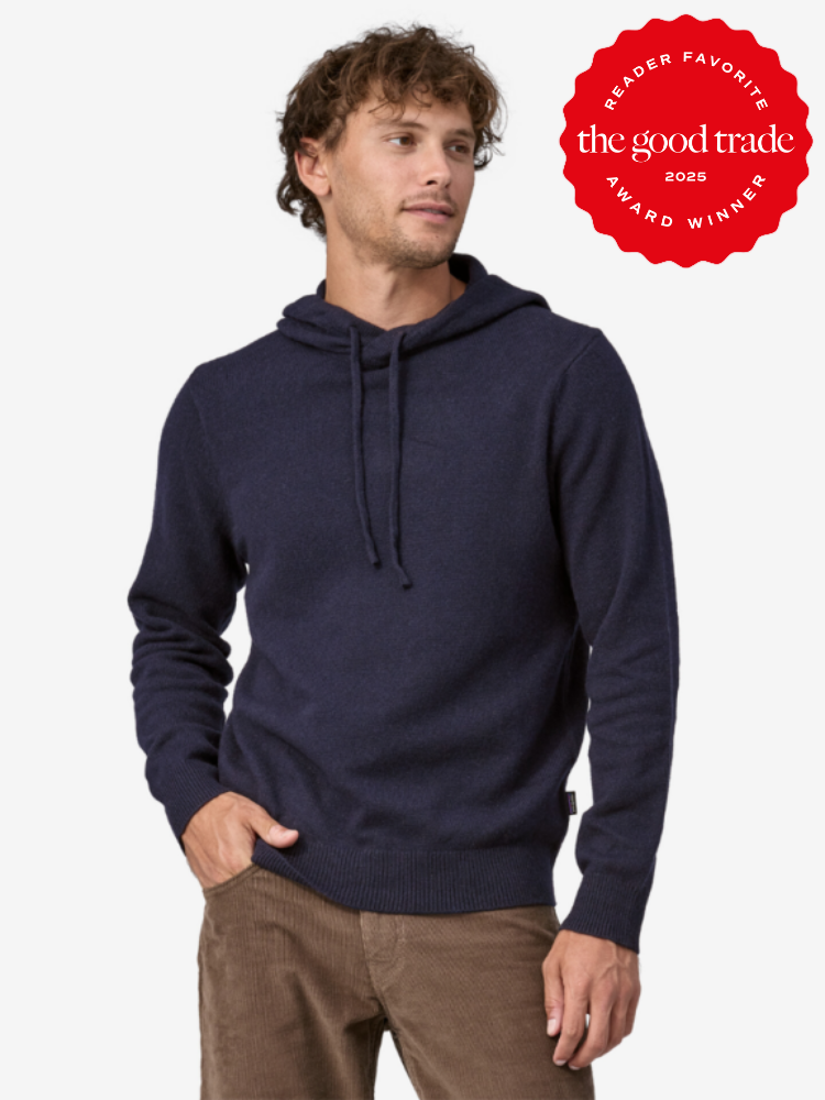 A person wearing a navy hoodie and brown pants looks to the side. A red badge on the top right reads "Reader Favorite, FashionGroomSpot, 2025 Award Winner.
