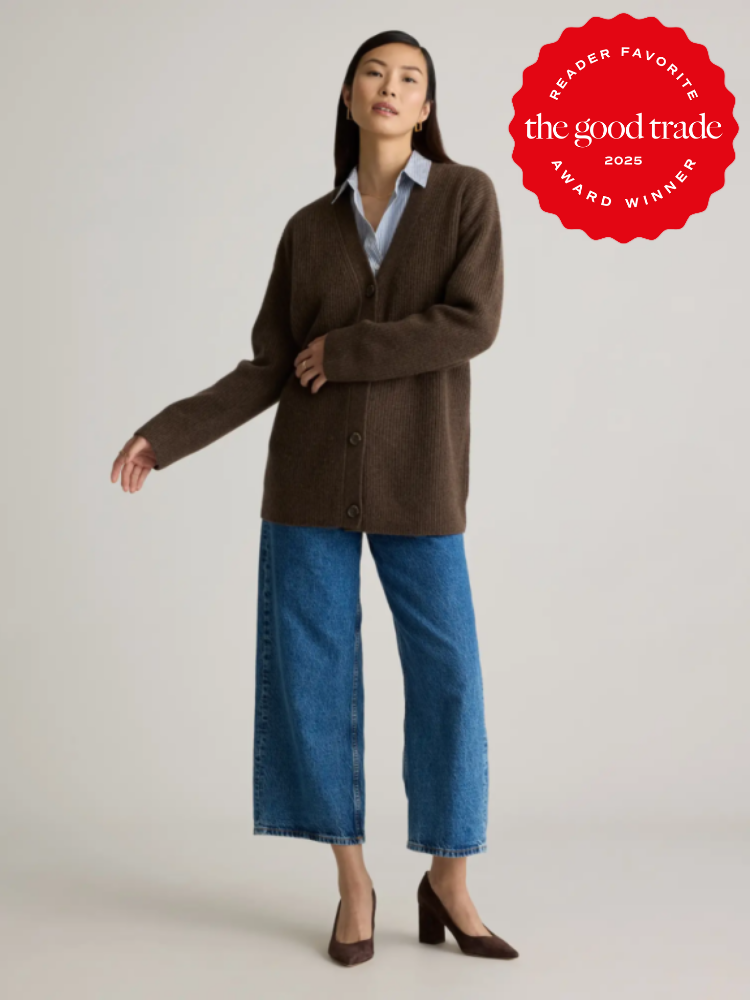 Person wearing a brown cardigan, blue jeans, and heels. A badge in the corner reads "Reader Favorite, FashionGroomSpot, 2025 Award Winner.