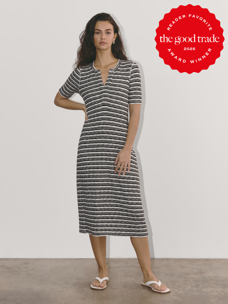 A woman in a striped dress and flip-flops stands against a white background. A red badge on the image reads "FashionGroomSpot 2025 Reader Favorite Award Winner.