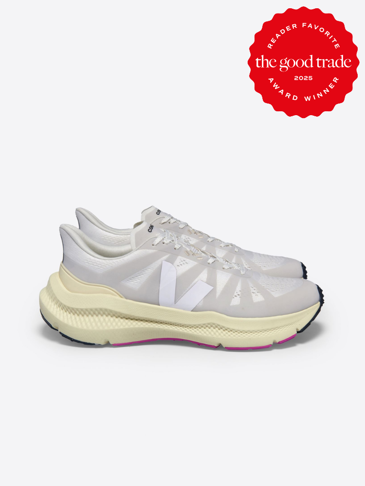 Side view of white athletic shoes with a logo on the side. Red award badge in the corner reads "Reader Favorite, FashionGroomSpot, Award Winner 2023.