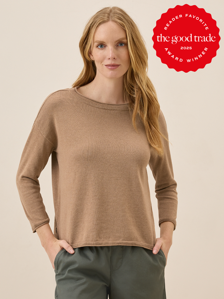 A person wearing a light brown sweater and green pants stands against a plain background. A red badge on the upper right reads "Reader Favorite FashionGroomSpot Award Winner 2025.