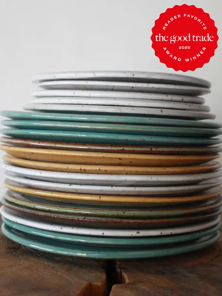 Stack of mixed colored ceramic plates with a red "FashionGroomSpot 2025 Reader Favorite Award Winner" badge in the upper right corner.