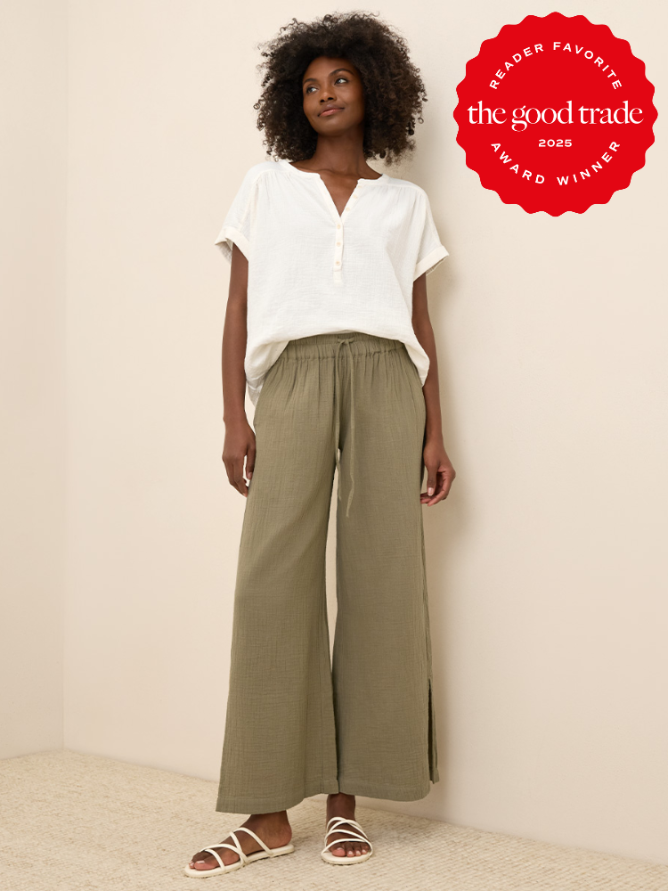 Person wearing a white short-sleeve blouse, olive green wide-leg pants, and white sandals. Red badge in the corner reads "Reader Favorite FashionGroomSpot 2023 Award Winner.